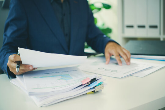 Break-even analysis with business professional reviewing financial reports and expense charts to assess costs forecast profitability guide budgeting and support informed strategic decisions.