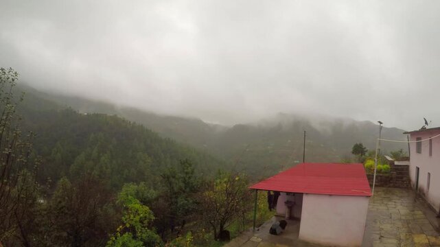 Time Lapse Of Heavy Fog Blowing Over Small Mountain House During Monsoon