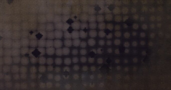 Moody grungy animation with scattered pixelated  diamond and circle shapes in beige and brown tones with a semi symmetrical layout and vintage flicker