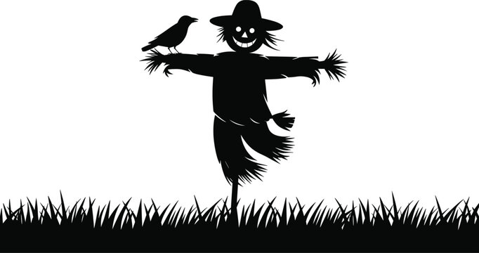 Spooky halloween scarecrow silhouette standing in a grass field with a crow perched on its arm