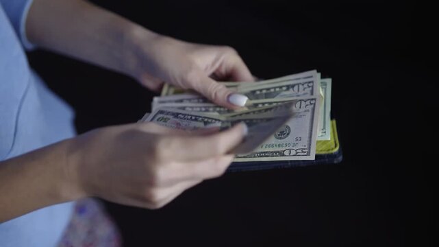 Hands Counting US Dollar Banknotes. Taking Cash Money Out Of Wallet. Personal Savings 