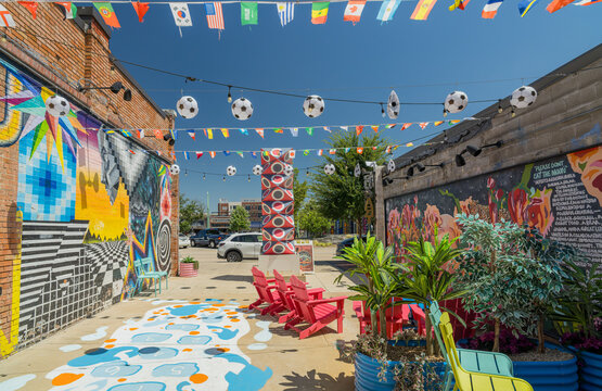 Colorful outdoor patio with murals and soccer decorations