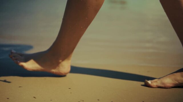 Barefoot Tourist Walking On Wet Sandy Beach. Coastal Environment. Summer Vacation 
