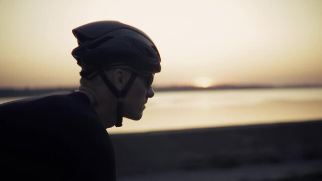 Cyclist Riding Bike Near Sea Coast At Sunset. Road Cycling. Lifestyle Healthy 