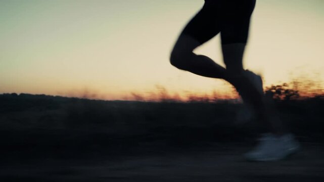 Runner Jogging Outdoor At Sunset. Cardio Training. Dynamic Running Movement Exercise. Active Lifestyle