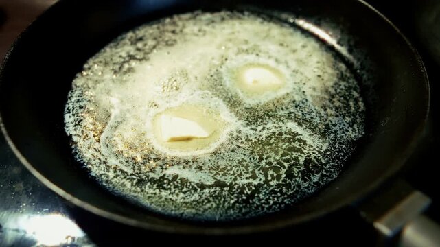 Butter Melting Sizzling In Hot Frying Pan. Cooking Ingredient. Home Kitchen 
