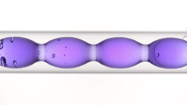 Vertical big focus on air bubbles rising through violet transparent solution as it fills and drains from a bulb lab condenser on pure white | Blue mallow flower infusion cosmetic ingredient concept