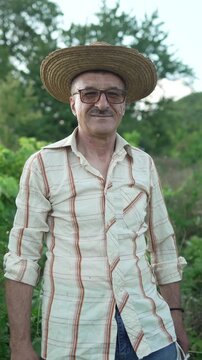 Mature male farmer smiling in nature