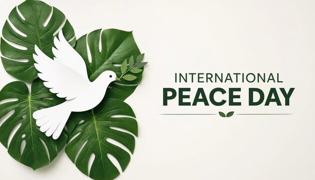 White dove flying over tropical monstera leaves for international peace day celebration and global harmony concept
