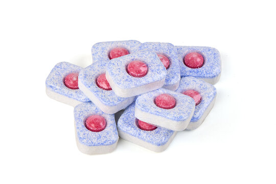 Dishwasher tablets with red gel isolated on white background