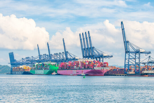 Shenzhen, China - May 22, 2026: Container ships berthed at Shenzhen Port cargo terminal with loading cranes and shipping containers. International trade, maritime logistics, port infrastructure