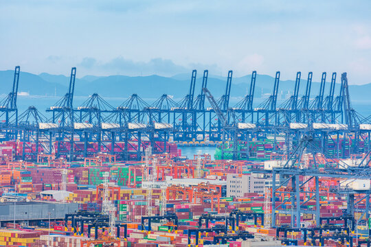 Shenzhen, China - May 22, 2026: Shenzhen Port with container yards, cargo cranes and berthed vessels. Port operations, global shipping, freight logistics and international trade infrastructure in Asia