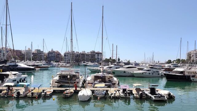 View of yachts and sailboats moored at Marina Zeas in Pasalimani, Piraeus, Greece. Captured on a sunny summer day.