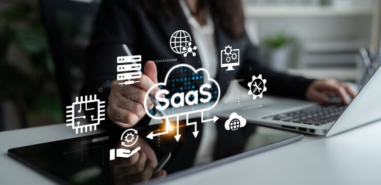 Professional Businesswoman Working on Software as a Service Concept with Digital Icons and Graphics in a Modern Office Environment. Entropy.