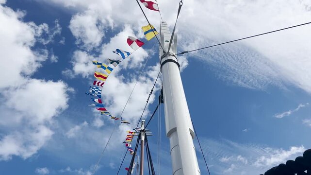 Marine Flags flying in the wind, Sailing Boat