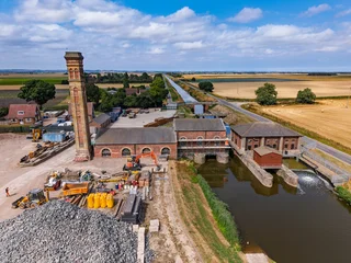 Aerial view of Lade Bank pumping station in Lincolnshire UK pumping station in an open field © MD Media