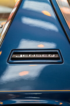 Gothenburg, Sweden - May 30 2026: Blue Jensen Interceptor badge closeup with glossy paint reflections.