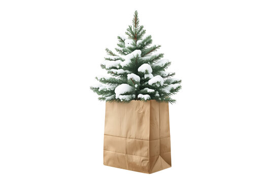 Small snow covered Christmas tree in folded paper bag