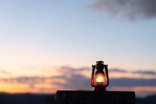 A glowing vintage lantern at dusk, symbolizing hope, faith, and inner light. A calm, spiritual image of peace and light overcoming darkness.