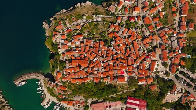 Aerial drone shot of ancient stone houses and roofs in Vrbnik village