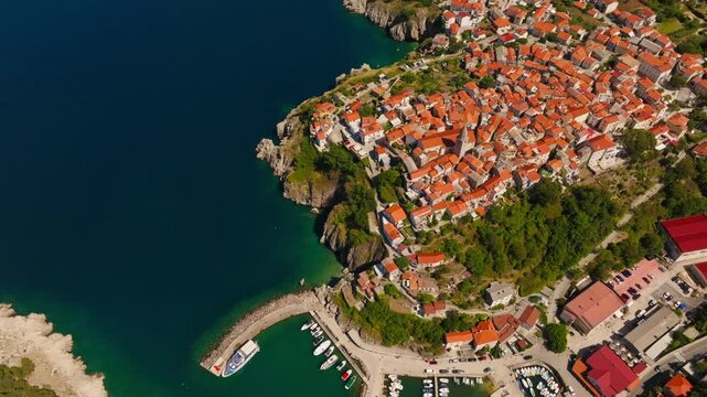 Drone panorama of sunny Vrbnik cityscape and traditional Mediterranean buildings