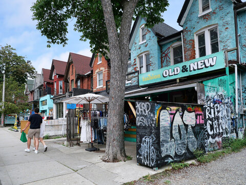 Vintage clothing store with outdoor display on sidewalk, Kensington Market bazaar, Toronto