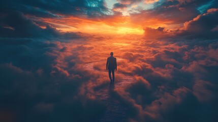 Fototapeta premium Silhouette of a man in a suit walking on a winding path through a sea of clouds