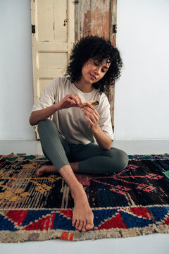 Woman holding palo santo stick practicing spiritual ritual