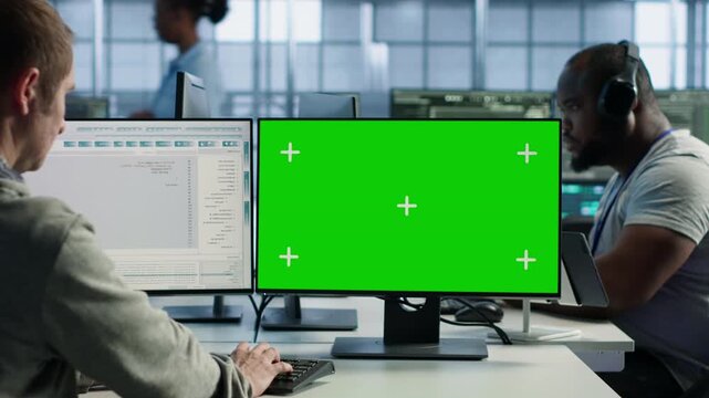 Engineer in server hub using mockup PC to repair equipment storing datasets while connecting protected data, access control and server room reliability.
