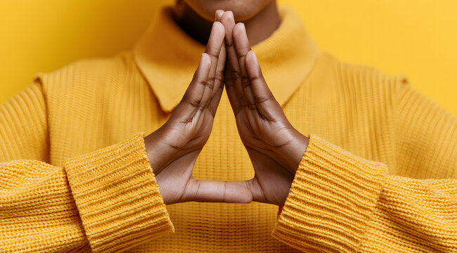 A focused image of a person performing a timeout gesture with their hands.