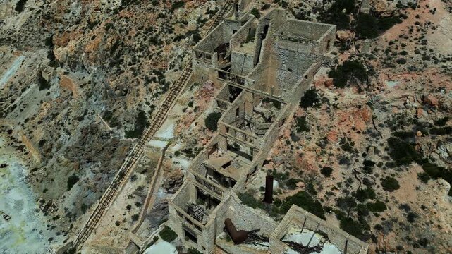 Close to long shot of the Old Slufur Mines Thiorichia, Milos, Greece. Showing the full scale. Shot on a 4k at 60 fps on a DJI Mini 3 Pro in D-Log Film Colorgraded