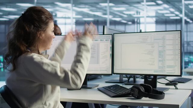 System admin operating in computer network security data center from a secondary camera angle while capturing firewall review, server bottlenecks and technical problem solving.