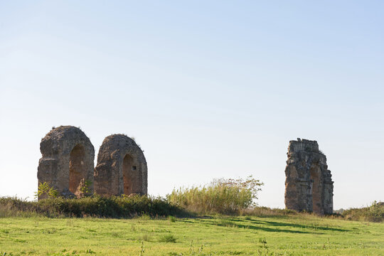 Ruins of ancient Roman Empire architecture with twin monumental arches in Parco degli Acquedotti
