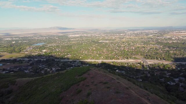 4K Aerial Drone Video Summer Sunrise Over Fernwood Cabin Trail Layton Utah Looking West Across Davis County Valley to Great Salt Lake and Wasatch Mountains