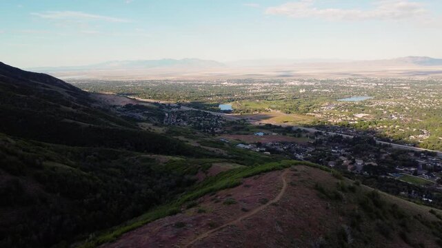 4K Aerial Drone Video Summer Sunrise Over Fernwood Cabin Trail Layton Utah Looking West Across Davis County Valley to Great Salt Lake and Wasatch Mountains