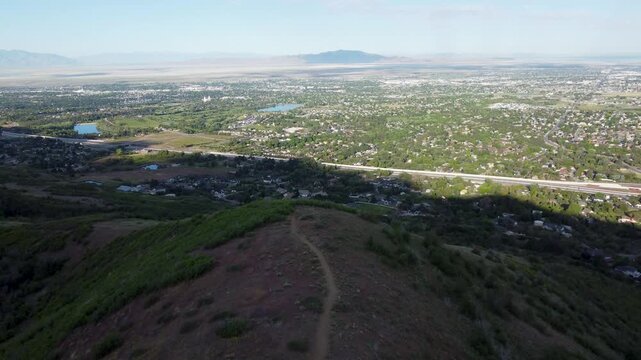 4K Aerial Drone Video Summer Sunrise Over Fernwood Cabin Trail Layton Utah Looking West Across Davis County Valley to Great Salt Lake and Wasatch Mountains