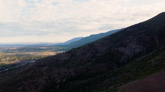 4K Aerial Drone Video Summer Sunrise Over Fernwood Cabin Trail Layton Utah Looking West Across Davis County Valley to Great Salt Lake and Wasatch Mountains