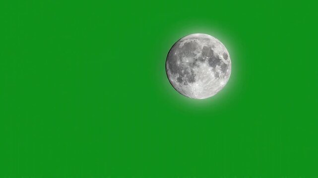 full moon rising on a chroma green backdrop