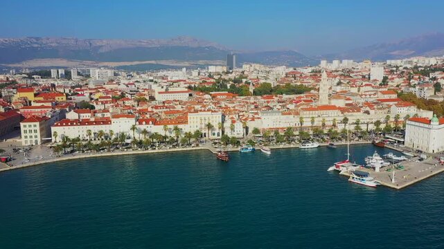 Aerial film of the coast of Split, Croatia, a historic place with old houses and castles on the seafront in Europe