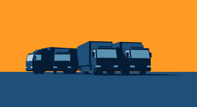 Three Large Trucks Side By Side.