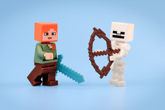 Minecraft Alex carries a Diamond Sword while facing a Minecraft Skeleton holding a brown Bow against a blue background on Jul 25, 2026 in Jakarta, Indonesia