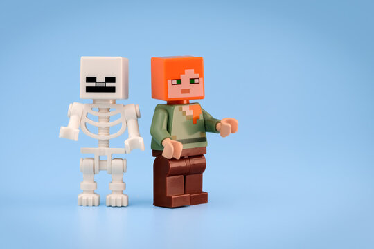 Minecraft Skeleton and Minecraft Alex toy figures stand closely together against a plain light blue background on Jul 25, 2026 in Jakarta, Indonesia
