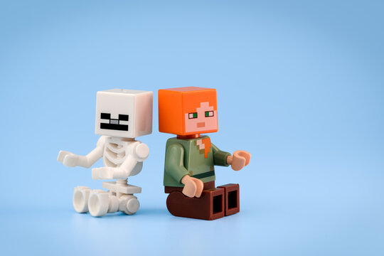 Minecraft Skeleton and Minecraft Alex toy figures sit side by side against a clean light blue background on Jul 25, 2026 in Jakarta, Indonesia