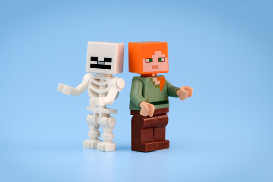 Minecraft Skeleton and Minecraft Alex toy figures stand side by side against a minimal light blue background on Jul 25, 2026 in Jakarta, Indonesia