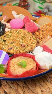 Authentic Mexican handcraft candy mix on a woven placemat