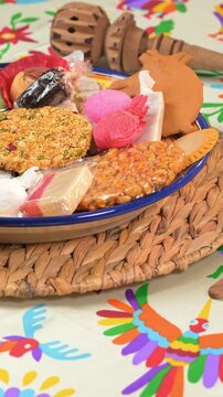 Mexican culinary traditions. Assorted "dulces tipicos" and hot chocolate whisk on the back