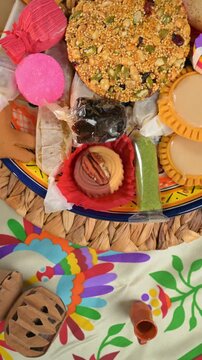 Top view of traditional Mexican treats and colorful candies on a talavera plate