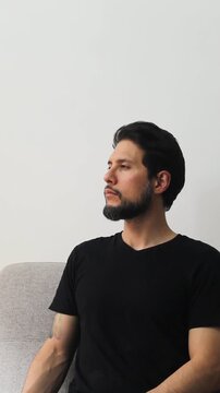Vertical detailed view of a latin man with the eyes closed in a peaceful attitude