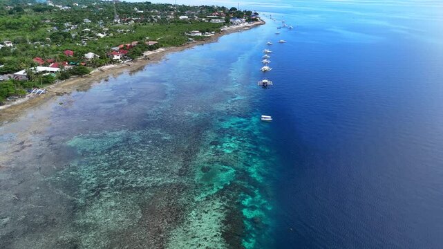 Aerial view of boats along a reef drop-off, Moalboal, Cebu, Philippines