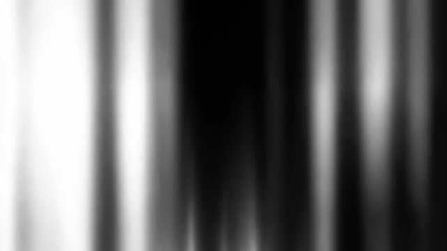 Abstract blurred black and white gradient background with smooth vertical lines and soft transitions. Modern minimalistic texture perfect for creative digital projects and contemporary design concepts